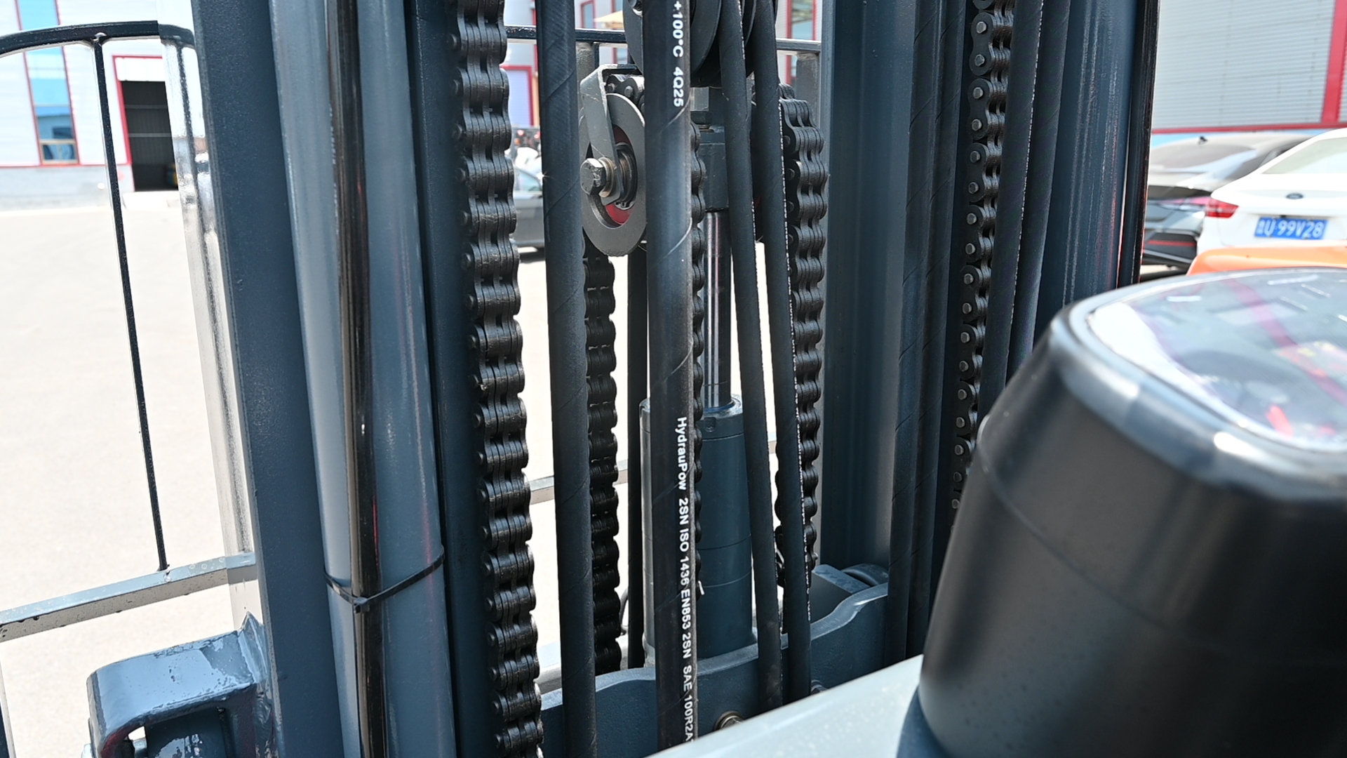 Close-up inspection of HUAYA forklift chassis welding quality showing continuous uniform weld beads on Q345B structural steel